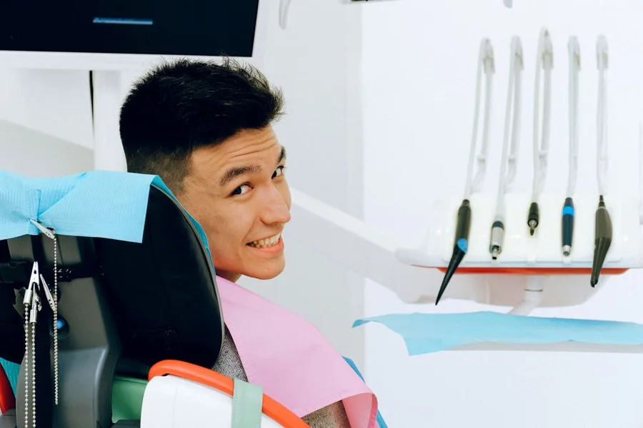Happy young patient smiling at his Fort Myers dentist visit